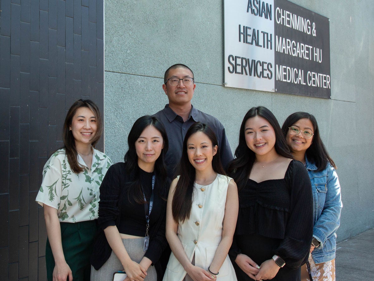 Lay counselor Ben Wang with the team he works with at Asian Health Services in Oakland.