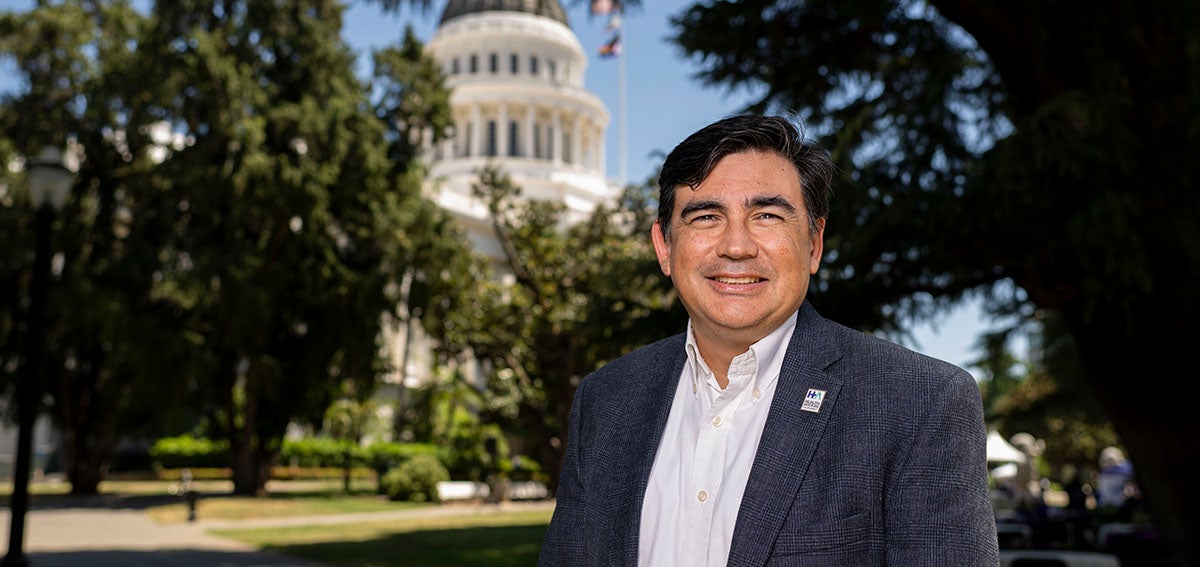 Anthony Wright stands in front of the California State Capitol Building
