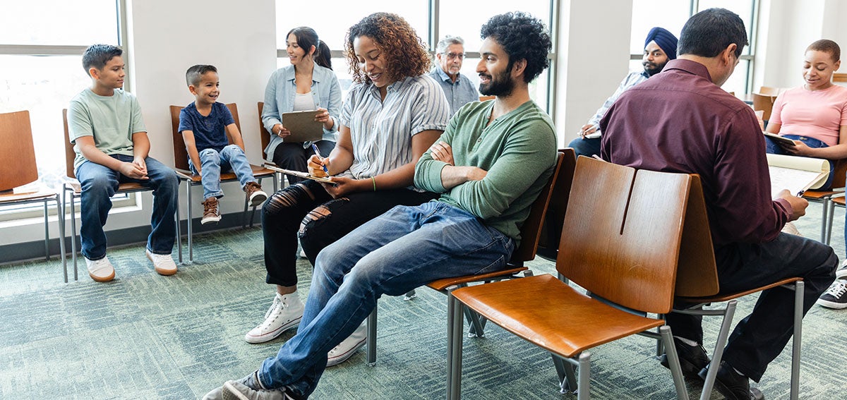 Crowd of people win a medical office waiting room