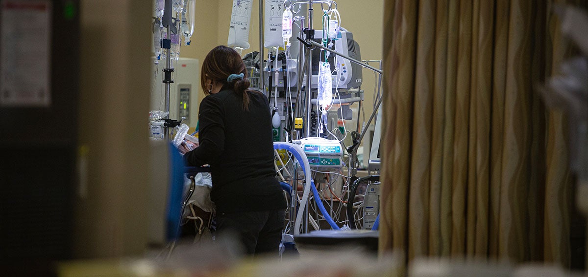 California Regulator Adopts Rule to Restrain Health Costs. A nurse is shown caring for a patient in the emergency room of a hospital in Hollister, California