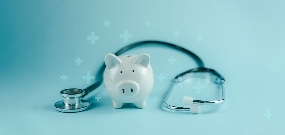 Piggy bank with stethoscope draped around it.
